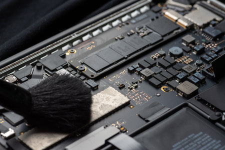 close up of Technician repairing electronic circuit board, repairing, upgrade and technology.の写真素材