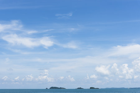 clear blue sky background,clouds with background, Blue sky background with tiny clouds. White fluffy clouds in the blue sky.の写真素材