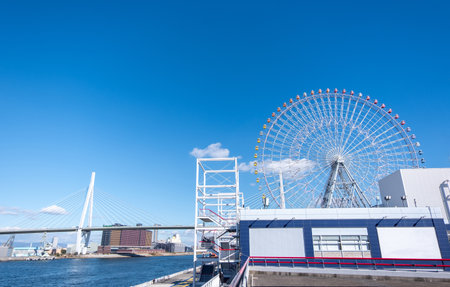 Ferris wheel on a background of blue sky in the amusement park in Osaka, Japan.の写真素材