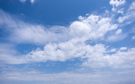clear blue sky background,clouds with background, Blue sky background with tiny clouds. White fluffy clouds in the blue sky.の写真素材