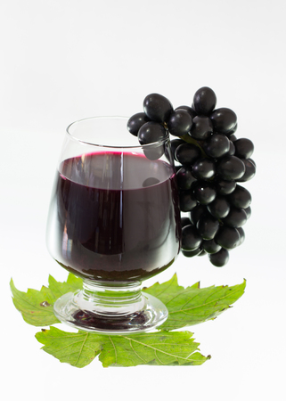 Ripe grapes and wine isolate on white backgroundの写真素材