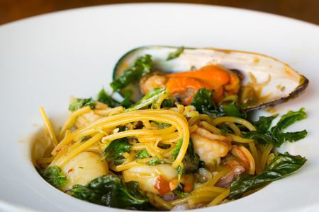 Spicy seafood spaghetti on dishの写真素材