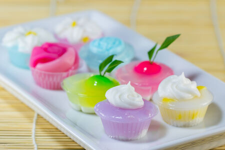 Colorful sweetness thai dessert put on plate on mat backgroundの写真素材