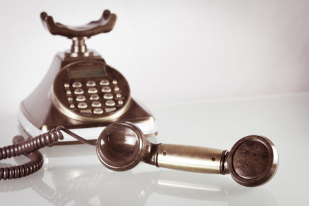 Old vintage telephone,Focus on handset in foreground in retro styleの写真素材