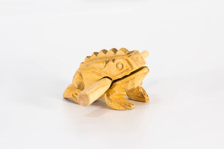 Wooden frog on white backgroundの写真素材