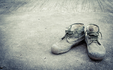 Old shoes on floor in vintage styleの写真素材