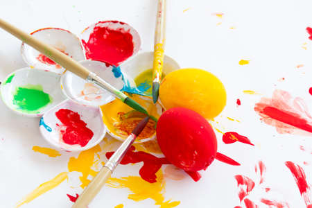 Colorful of easter egg with paintbrush and paletteの写真素材
