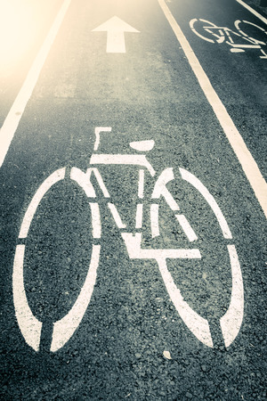 bicycle road sign painted on asphalt,vintage filterの写真素材
