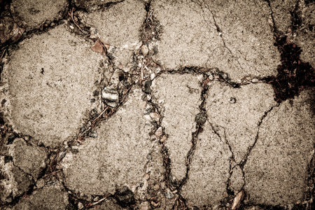grunge cement cracked with rock for textured background