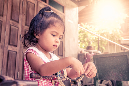 upset little girl in outdoor in vintage color toneの写真素材