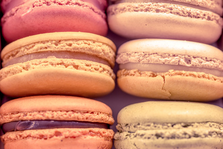 Sweet and colourful french macaroons in vintage color toneの写真素材