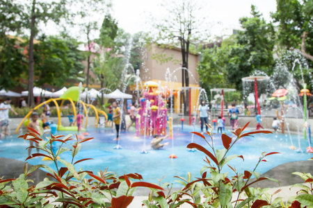 blur image of children's water fun park  at public playground for backgroundの写真素材