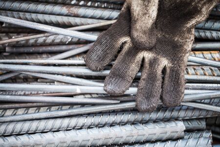 old dirty fabric glove of worker put on steelの写真素材