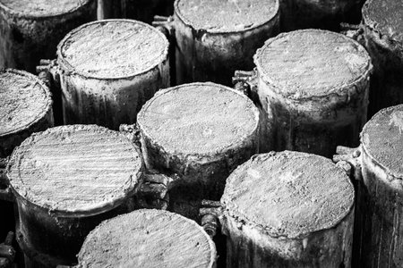 Concrete in steel cylinder formwork for testing of strength compaction in black and whiteの写真素材
