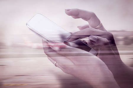 Business technology concept,Double exposure image of woman using cellphone,smart phone,phone and blurred airplane in airport background,vintage filterの写真素材