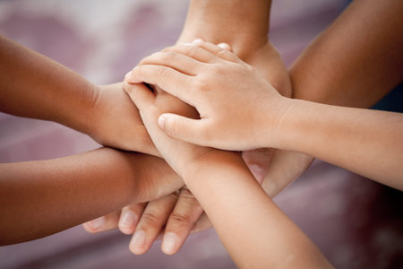 Family holding hands together in vintage color tone