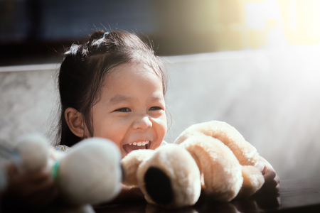 Portrait of happy cute asian little girl laughing in vintage color toneの写真素材