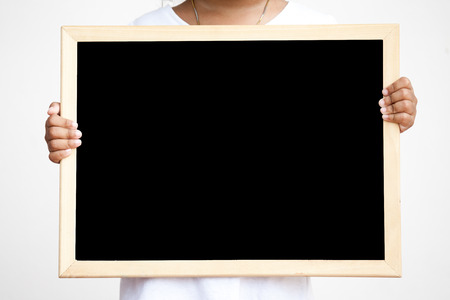 Child holding blackboard for background, texture for add text or your designの写真素材