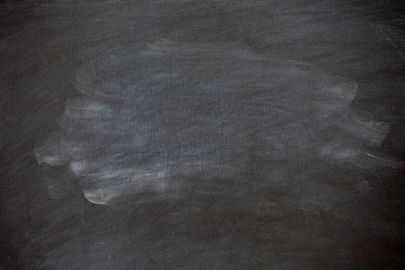 Closeup chalk rubbed out on blackboard for abstract backgroundの写真素材