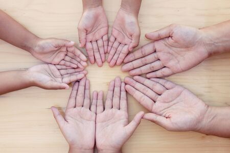 Parent and children  open the palm of the hand in circle showing unity and teamworkの写真素材