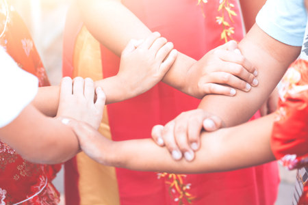 Children holding hands and playing together with unity and teamwork