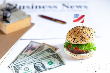 Delicious homemade hamburger with fresh vegetables in the office, busy businessman eating junk food...