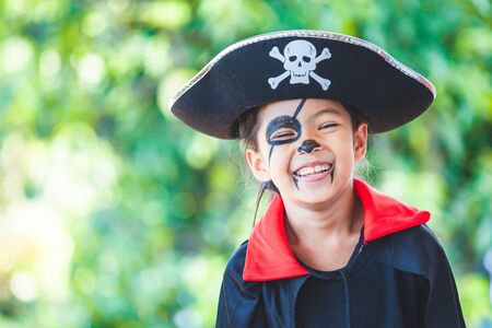 Cute asian child girl wearing halloween costumes and makeup having fun on Halloween celebrationの写真素材