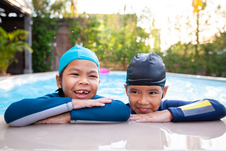 Aerial view or top view of children are swimming in the swimming pool