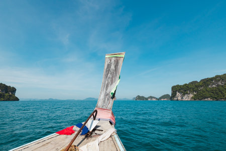 Amazing view from over Thai traditional wooden longtail boatの写真素材