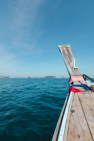Amazing view from over Thai traditional wooden longtail boatの写真素材