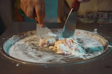 Process of making fried ice-cream dessert in night market. Thai famous gourmet street dessert food. Street food in Thailand.の写真素材