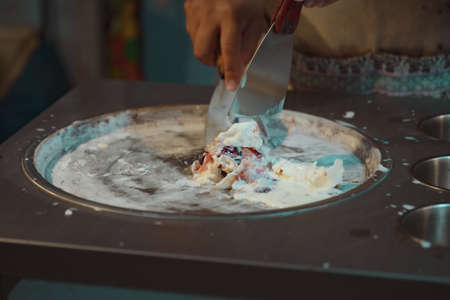 Process of making fried ice-cream dessert in night market. Thai famous gourmet street dessert food. Street food in Thailand.の写真素材