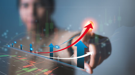 Businessman touching symbol arrow up with stock graph and chart background. Growth business and investment in stock market, strategy for making market plan concept.の写真素材