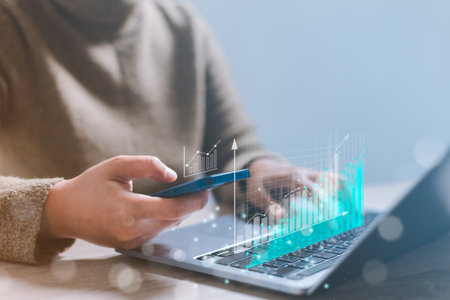 Business people analyze sales data and graph economic growth. Trader is showing a growing virtual hologram stock, Analysis of forex trading finance and banking. Business investment growth up concept.の写真素材