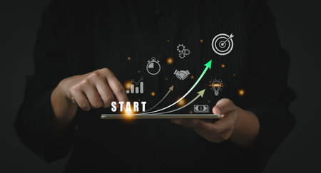 Startup business concept. Business people touching on tablet with icon business and network connection on modern virtual interface from digital tablet on dark background.の写真素材