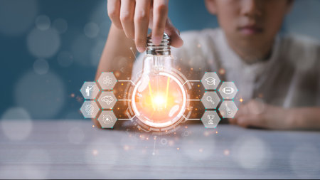 Girl holding light bulb with virtual education graduate icon. E-learning education, smart learning...