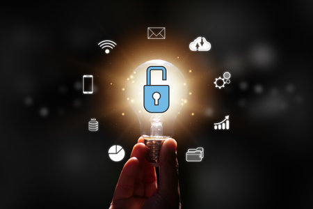 Hand holding light bulb with padlock and virtual AI business icon. Cyber security, internet privacy data protection and information technology concept.の写真素材