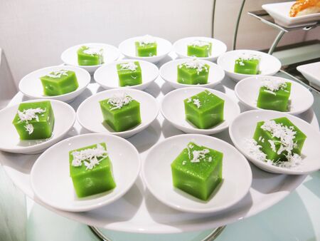 Green coconut sweet pudding on white plate.の写真素材