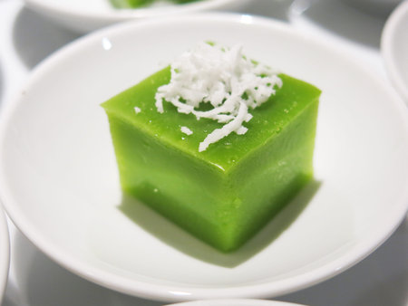 Green coconut sweet pudding on white plate.