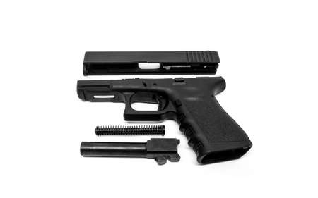 9mm Pistol is separated to pieces on white background.の写真素材