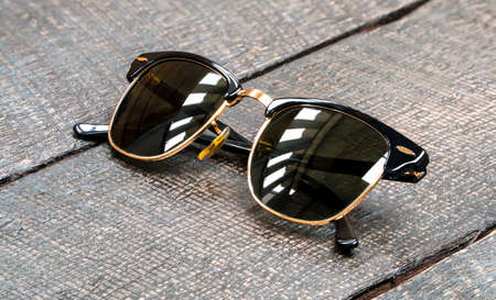 Sunglass on a wooden tableの写真素材