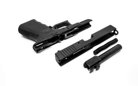 9mm Pistol is separated to pieces on white background.の写真素材
