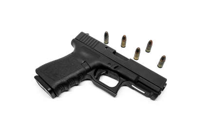 9mm pistol and bullets on white backgroundの写真素材