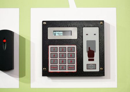 Remote alarm with an electronic scoreboard and buttons to input the codes