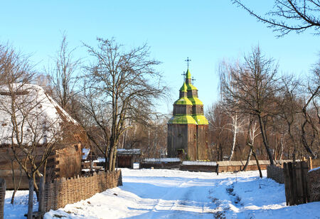 Wooden orthodox church at the rural street on a winter dayの写真素材
