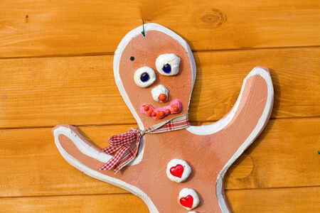 Decoration in the form of the fake  toy man  on the home wooden wallの写真素材