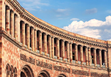 Facade of a massive building with galleries, columns and balconiesのeditorial素材