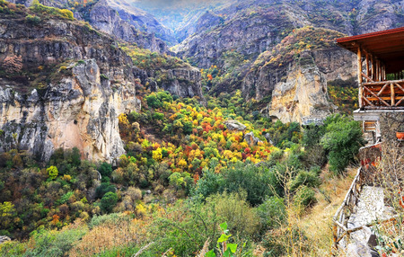 Autumn view  of rocks covered with a variety of trees and shrubsの写真素材