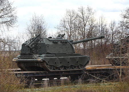152 mm self-propelled howitzer on crawler tracks on a railway platform
