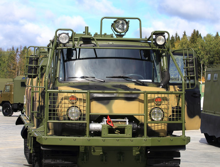 All terrain vehicle for transportation of people and goods in severe road and climate conditions with a metal casing and shock-proof outer frameのeditorial素材